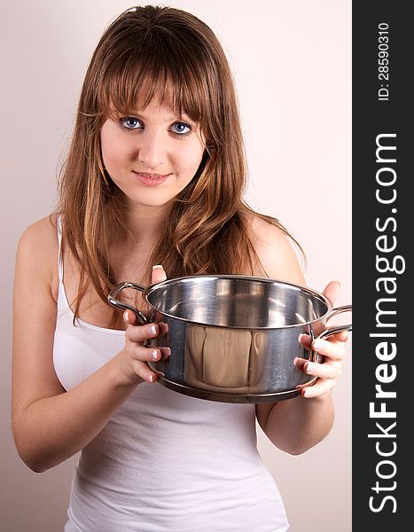 Teen girl shows a pot. Teen girl shows a pot.