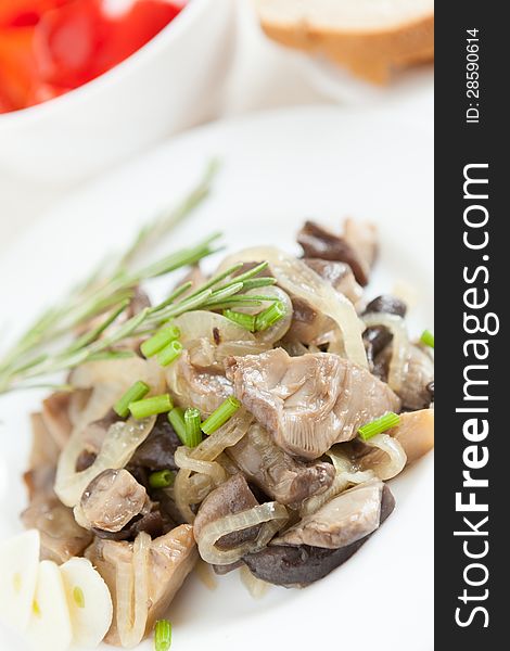 Roasted oyster mushrooms on a white plate