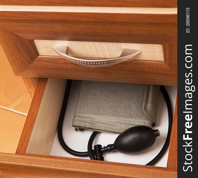 Tonometer in open desk drawer. Tonometer in open desk drawer