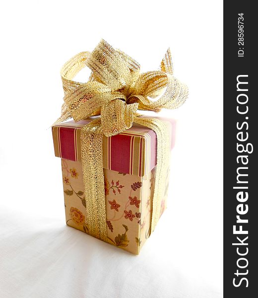 gift box in neutral colors on white background.  gift box in neutral colors on white background.