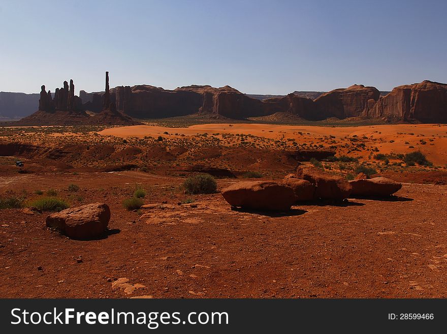 Fantastic shapes of the vast red sandstone buttes of Monument Valley, part of the Colorado Plateau in the Navajo Nation Reservation, Utah, USA. Fantastic shapes of the vast red sandstone buttes of Monument Valley, part of the Colorado Plateau in the Navajo Nation Reservation, Utah, USA