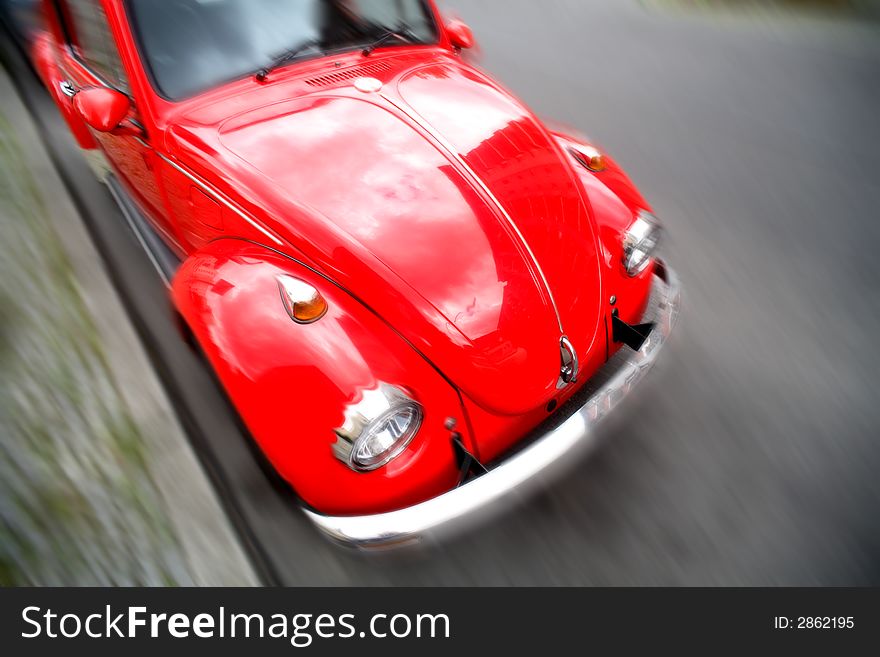 Rclassic red car with blur