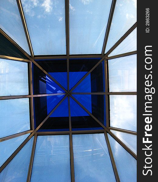 An image of a glass rooftop ceiling taken from the bottom