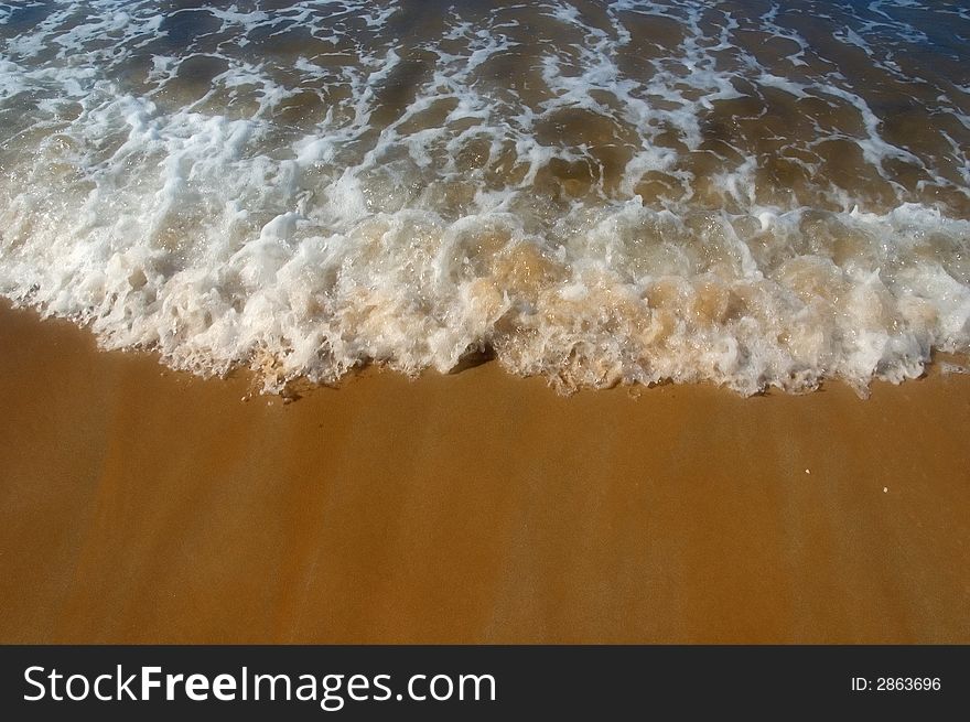 Sea froth on beach with slight soft focus effect