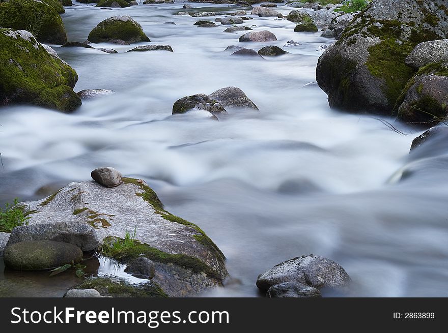 Small creek with a lot of stones and rocks. Small creek with a lot of stones and rocks