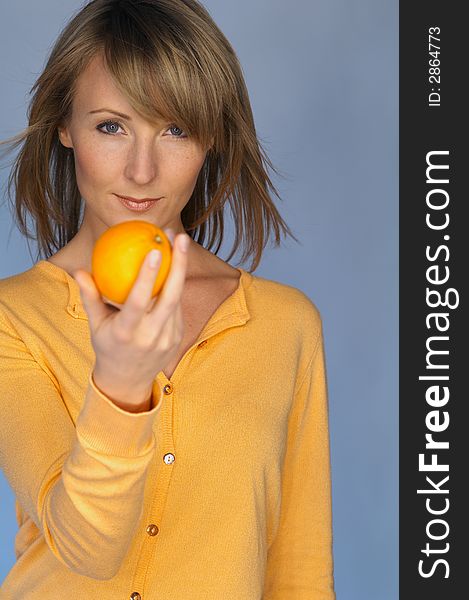Portrait of woman with  orange