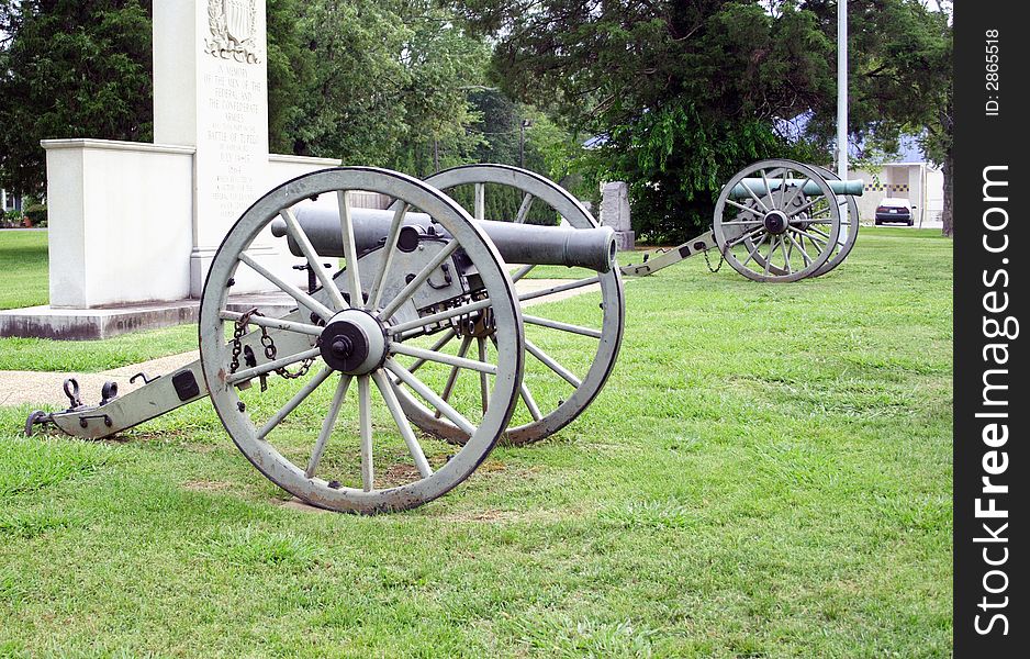 Two replicas of Civil War cannons sit on memorial land.