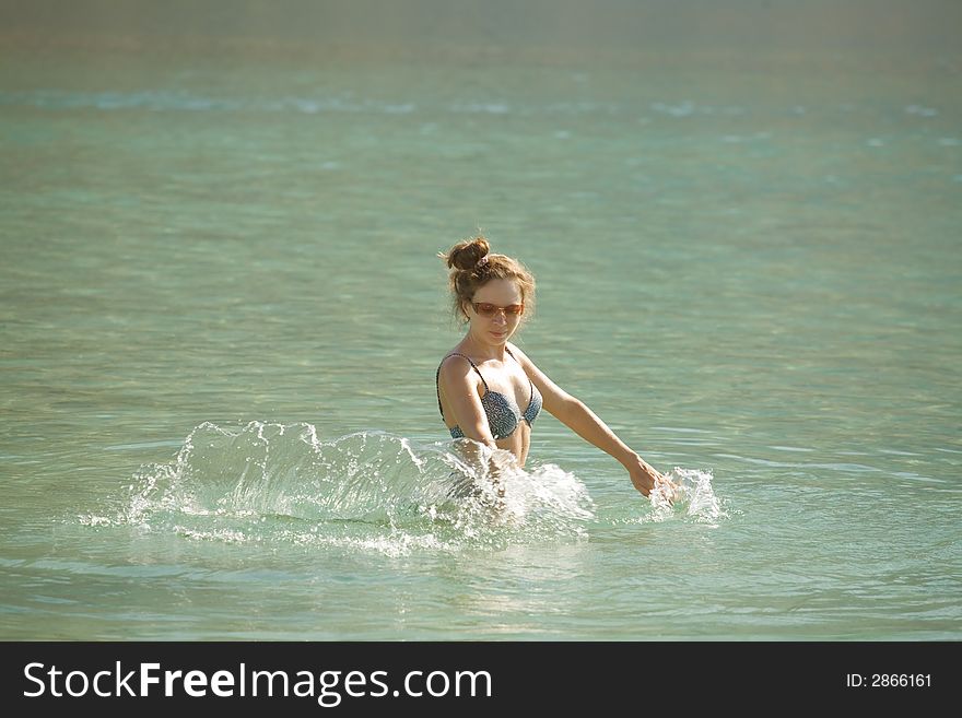 Woman enjoying the water, lake Kourna - Crete. Woman enjoying the water, lake Kourna - Crete