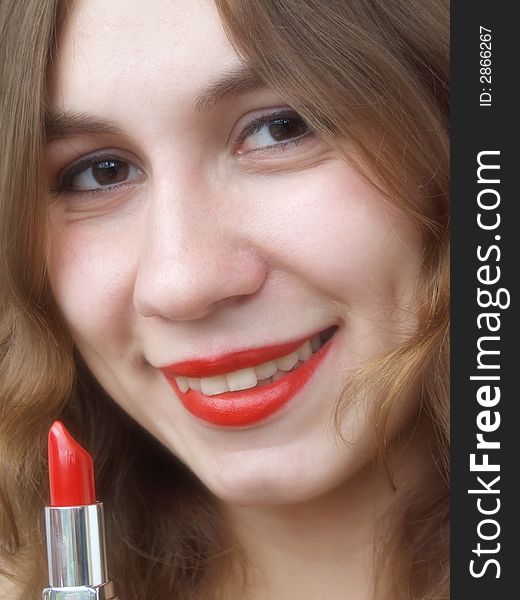 Smiling beautiful girl with lipstick