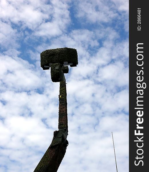 Portrait of military radar in blue sky