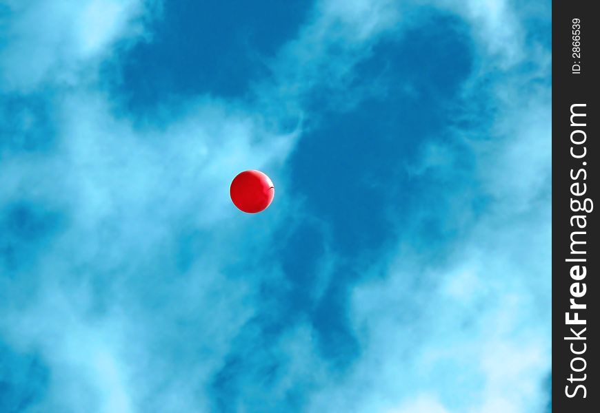Portrait of a single red ballon in blue sky. Portrait of a single red ballon in blue sky