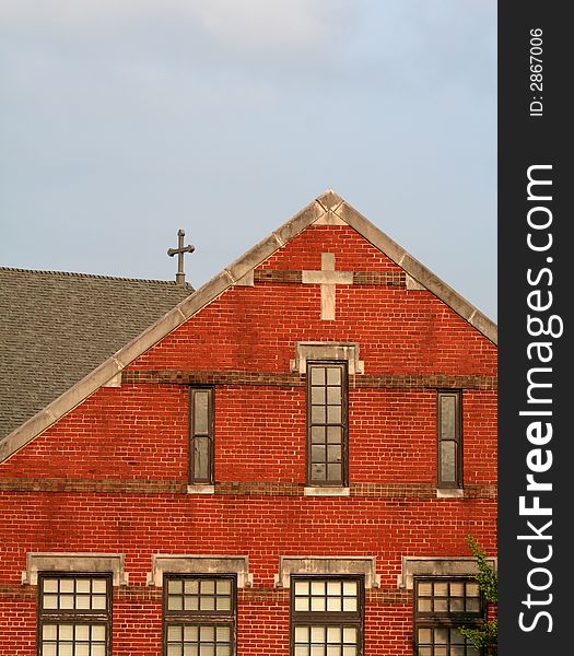 Old, red, brick church, cross on roof, old windows, cross on side of church. Old, red, brick church, cross on roof, old windows, cross on side of church
