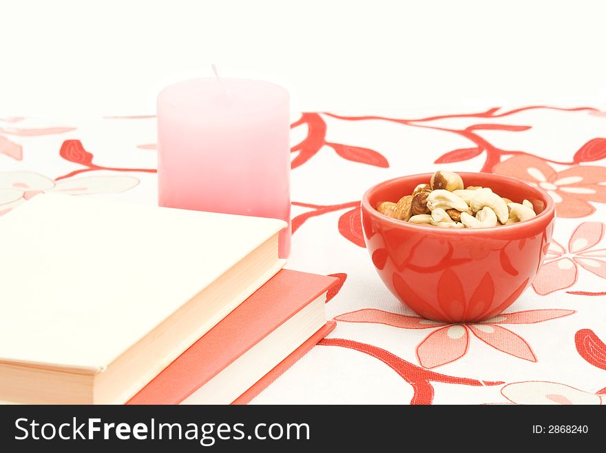 Red and white book on colorful tablecloth. Red and white book on colorful tablecloth