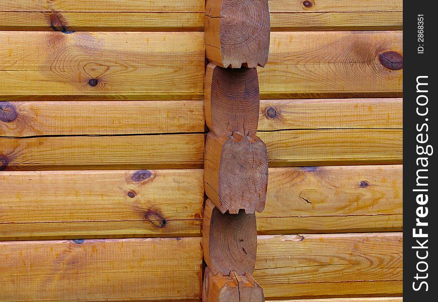 Details of a corner of a house made with wood logs. Details of a corner of a house made with wood logs