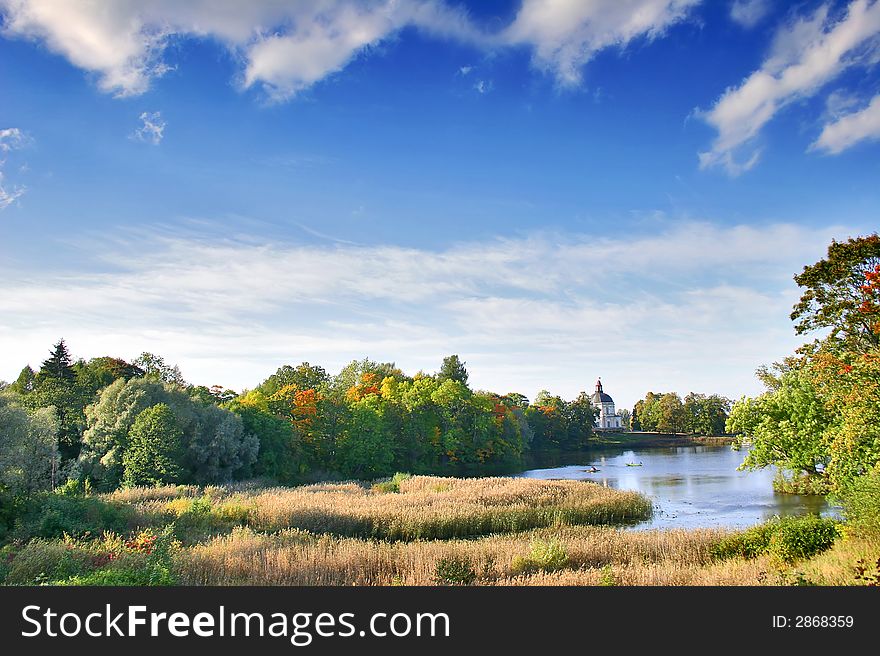 Autumn landscape with blue sky, trees and pond. Autumn landscape with blue sky, trees and pond