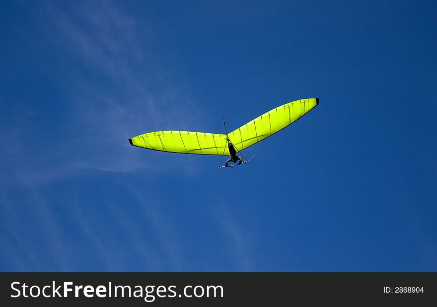 Green glider and blue sky. Green glider and blue sky.