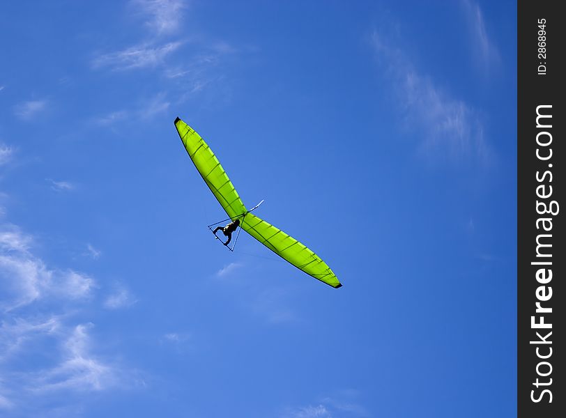 Green glider and blue sky. Green glider and blue sky.