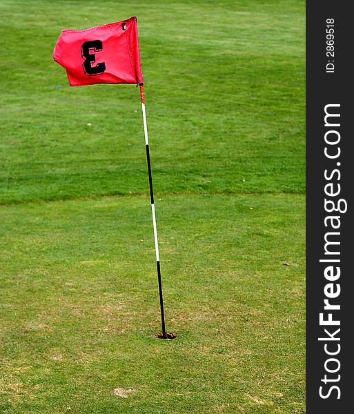 Golf field with red flag. Golf field with red flag.