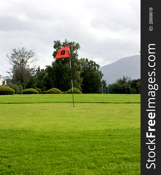 Golf field with red flag. Golf field with red flag.