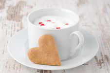 Cup Of Hot Milk With Foam, Decorated With Sugar Hearts And Heart Royalty Free Stock Photography Cup Of Hot Milk With Foam, Decorated With Sugar Hearts And Heart Royalty Free Stock Photography