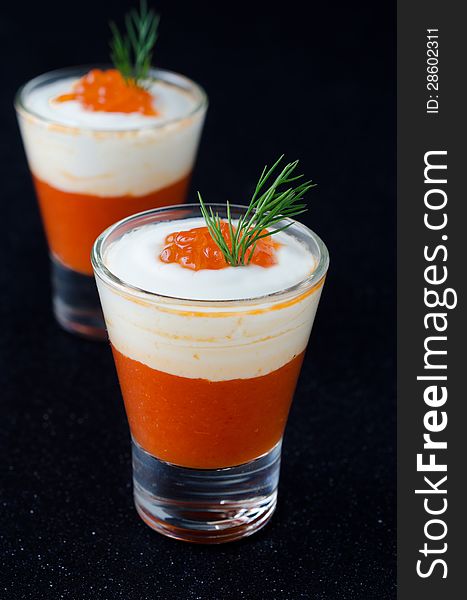 Appetizer of sweet pepper, cream and red caviar, two servings