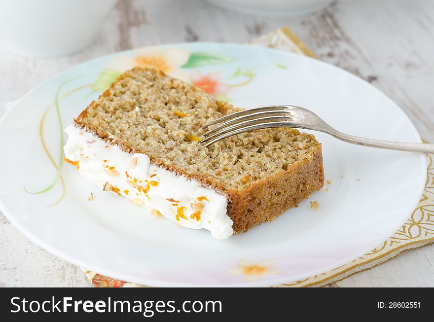 Piece of cake on a plate of orange horizontal closeup