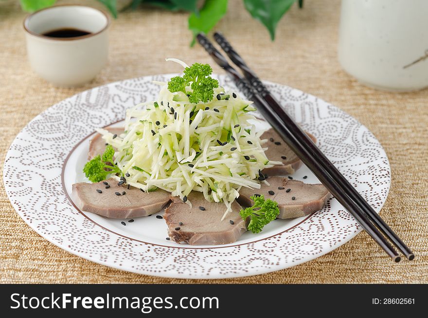 Oriental salad with beef tongue, celery and cucumber