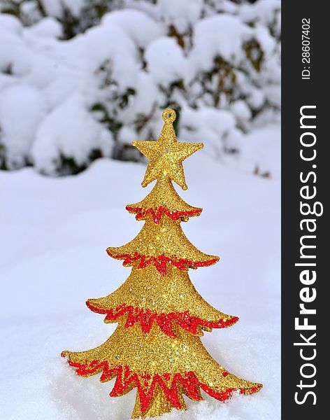 Image of a Christmas tree ornament on snow