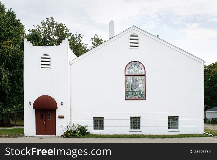 Small, white, stucco, neighborhood church in a simple Spanish design. Small, white, stucco, neighborhood church in a simple Spanish design.