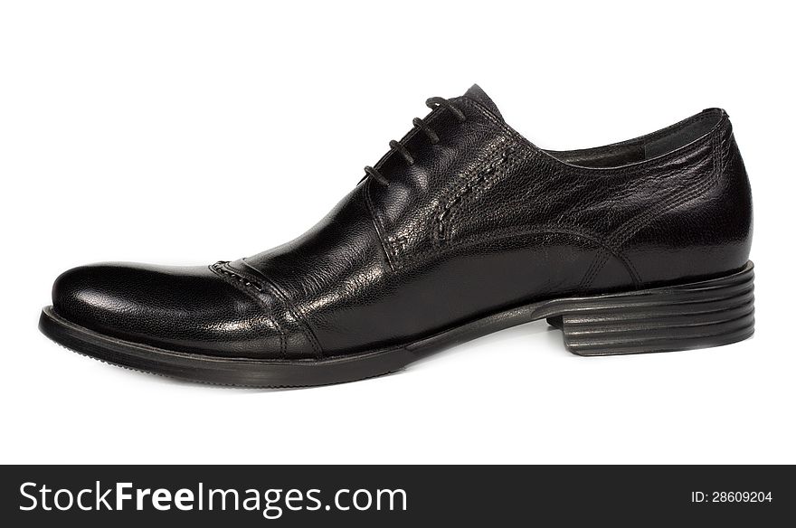 Sideways view of a mans low heeled classical black shoe with laces for everyday formal and office wear on a white studio background