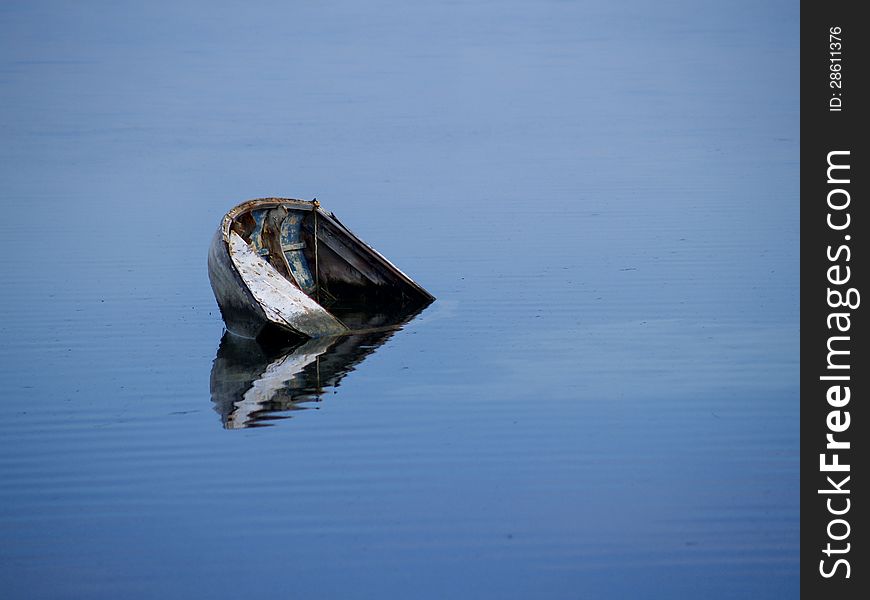 Sunken Boat In Blue Waters