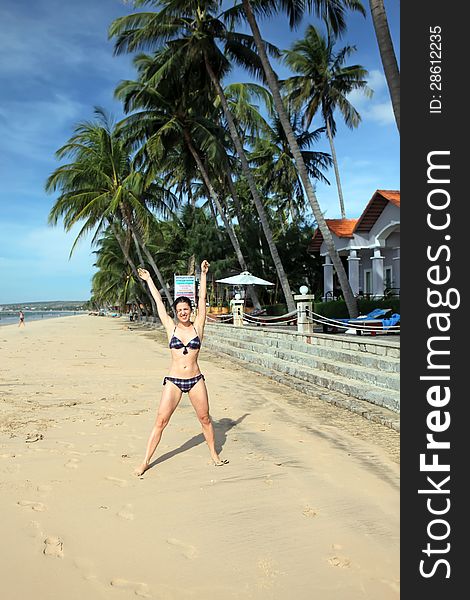 Cheerful Active Woman On The Beach