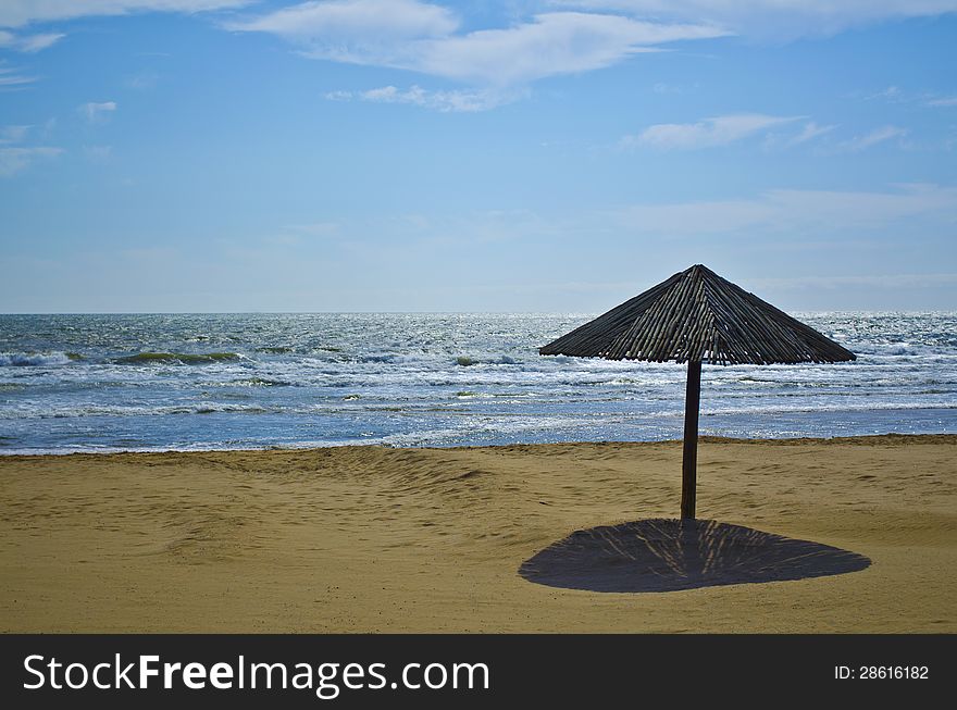 Wooden beach umbrella on Durban South Africa beach front