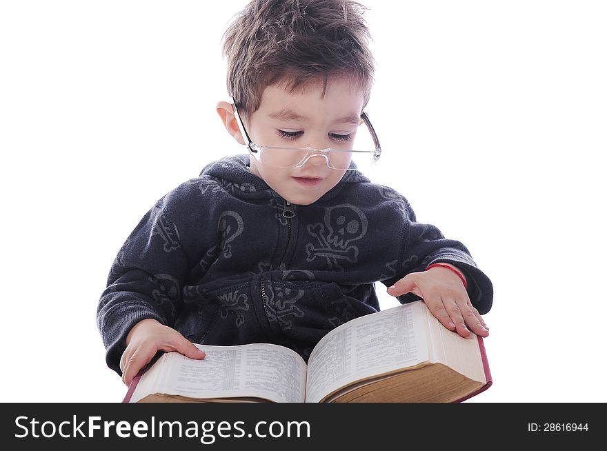 Little boy with big glasses readng a big book on white background. Little boy with big glasses readng a big book on white background