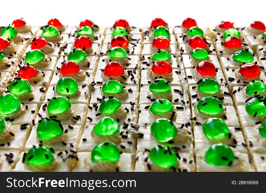 Isolates of cake squares with a green and red jelly on it greatly. Isolates of cake squares with a green and red jelly on it greatly.