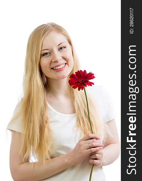 Portrait of a young happy woman with flower