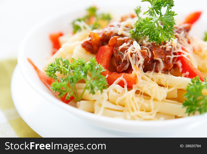 Pasta with vegetable sauce and parmesan cheese