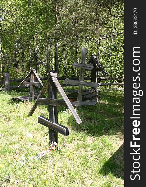 Wooden memorials in a Siberian graveyard. Wooden memorials in a Siberian graveyard.