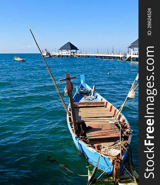 Small Blue fishing boat at the dock