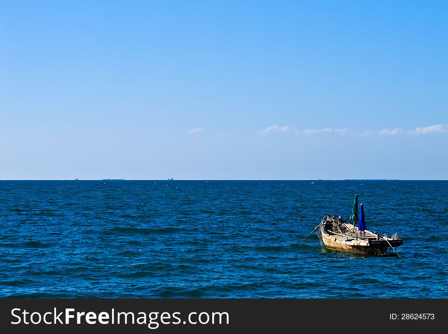 Lonely fishing boat on the sea. Lonely fishing boat on the sea