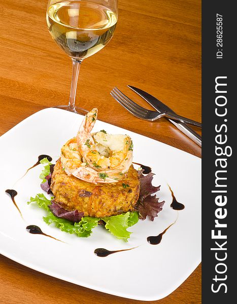 Two shrimps and latke on a bed of baby lettuce, served with a glass of white wine #2. Two shrimps and latke on a bed of baby lettuce, served with a glass of white wine #2.