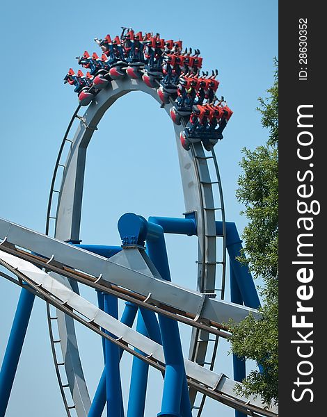 Rollercoasters at amusement park in action
