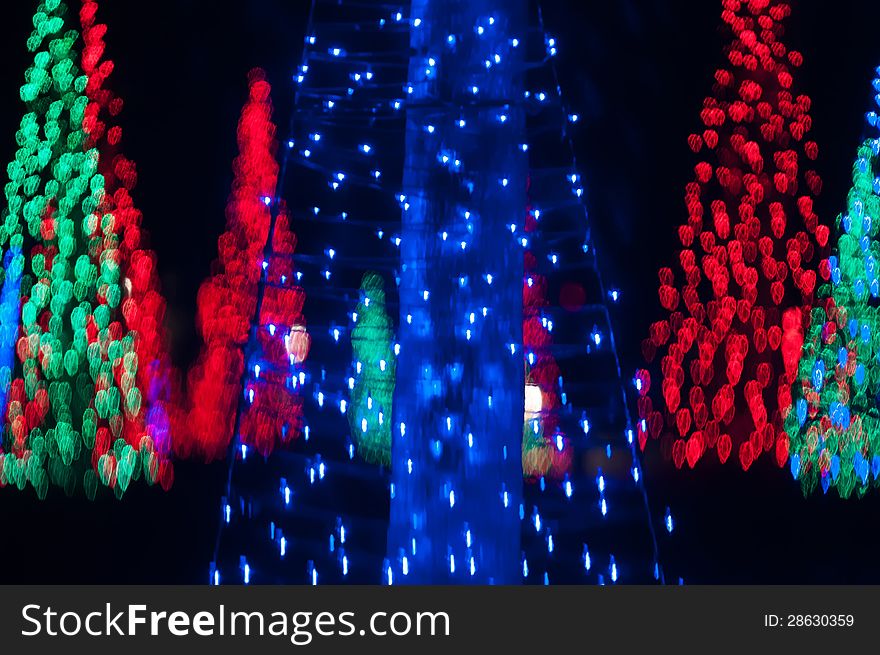 Abstract christmas trees out of focus at night. Abstract christmas trees out of focus at night