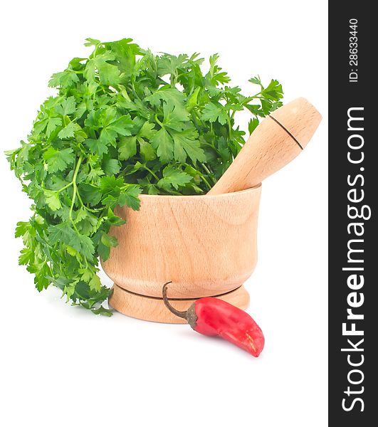 Wooden mortar with parsley and red chili pepper, food ingredient photo. Wooden mortar with parsley and red chili pepper, food ingredient photo