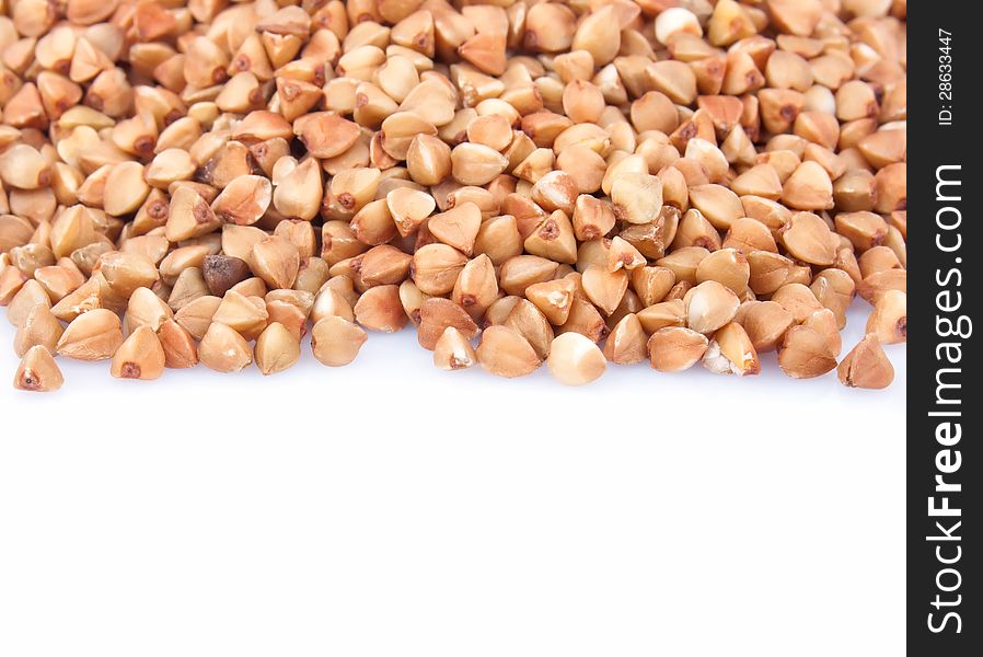 Raw buckwheat isolated on white background, food ingredient photo. Raw buckwheat isolated on white background, food ingredient photo
