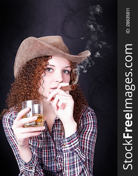 Pretty girl smoking a cigar