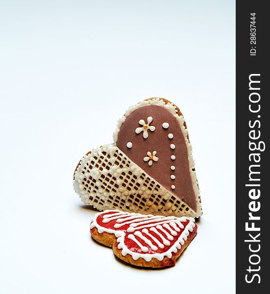 Decorative colorful gingerbread hearts on a white background