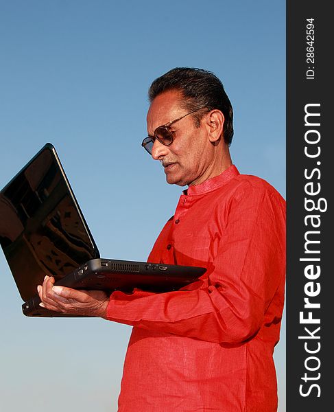 Old Indian Man Using Laptop