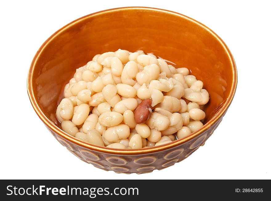 Stewed beans haricot in clay bowl