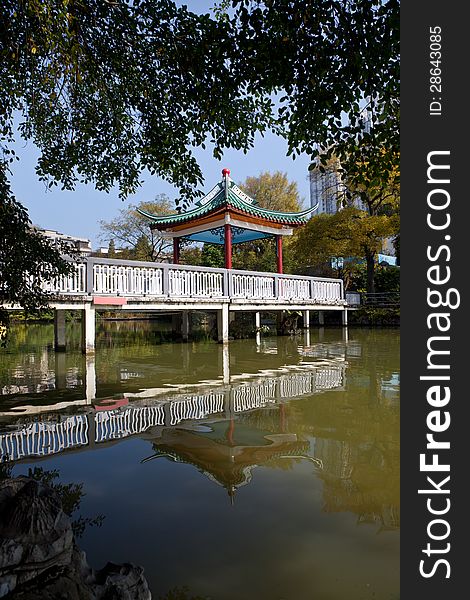 Chinese pavilion bridge in lake